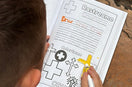 Child coloring a cross in Preschool Essentials: Spanish colroing book for toddlers. 