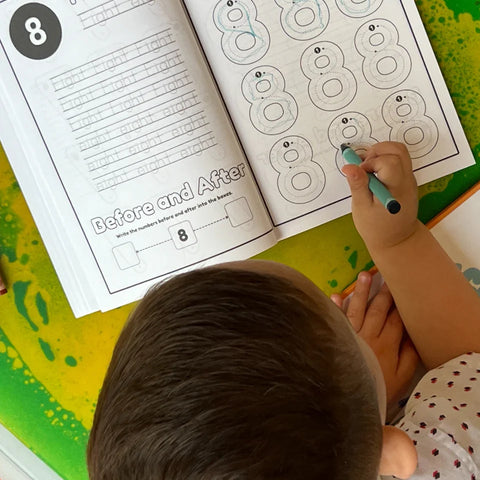 Toddler tracing number 8 in 123 Pigments educational coloring activity book